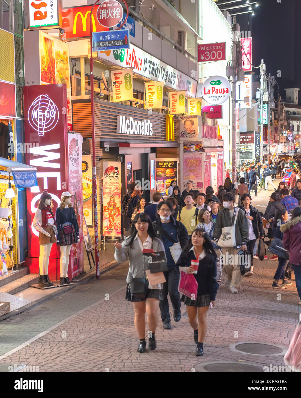 People,mostly youngsters, walk through Takeshita Street, a famous