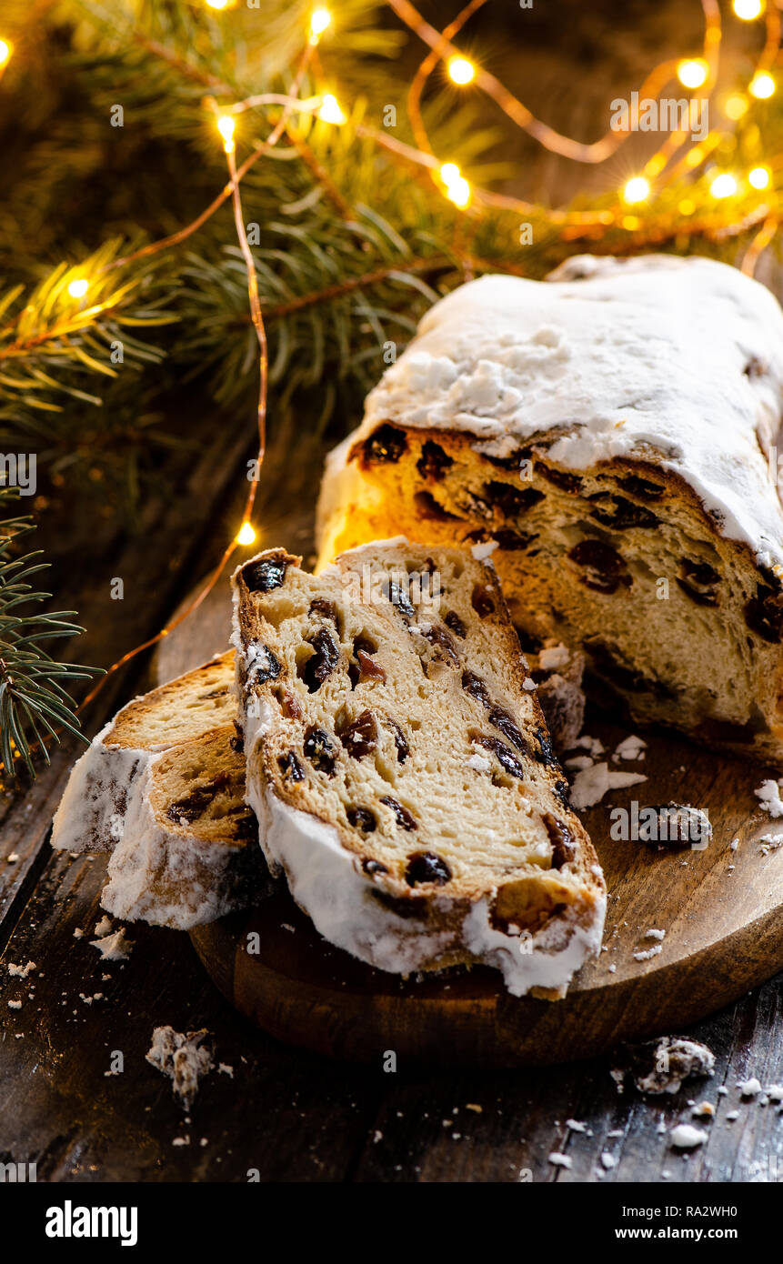 German Christmas Stollen with lights and pine branch Stock Photo Alamy