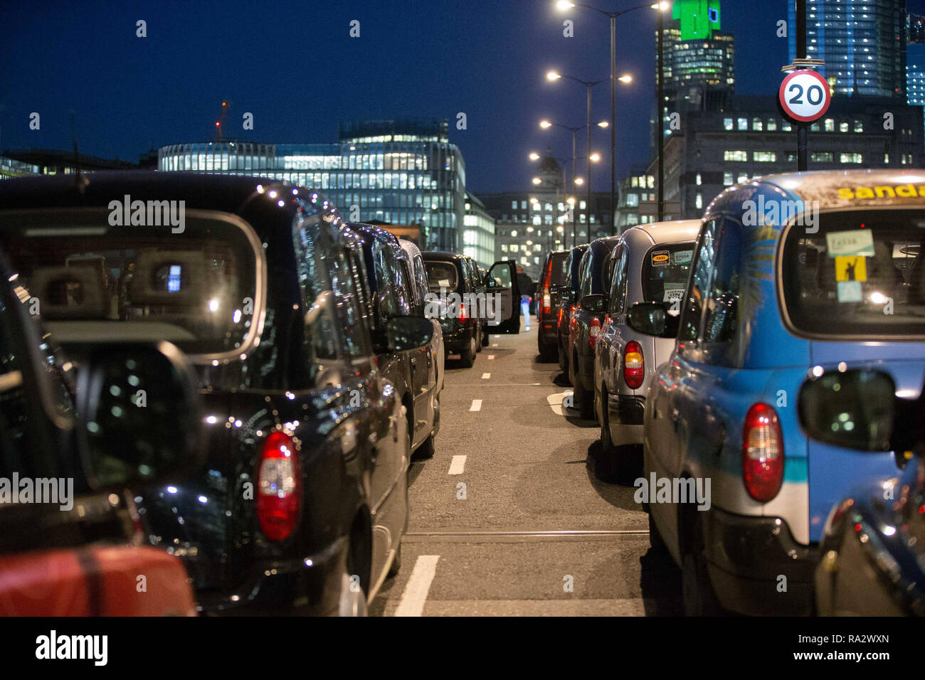 Black cabs have blocked London Bridge for the fifth evening running in protest against proposals to impose air quality restrictions around Tooley Street.  London licensed taxis are protesting against the Ultra Low Emissions Vehicle (ULEV) measures, which they claim will restrict trade and harm their business.  Featuring: View, Atmosphere Where: London, United Kingdom When: 30 Nov 2018 Credit: Wheatley/WENN Stock Photo