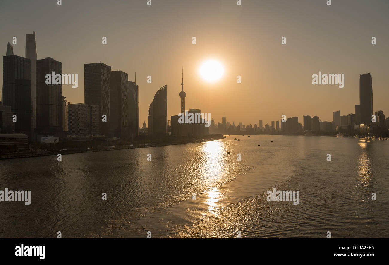 Skyline of the financial district in city of Shanghai at sunset Stock Photo