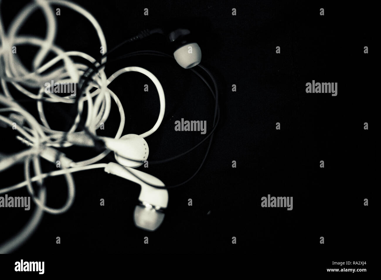 Headphone cable tangled Stock Photo Alamy