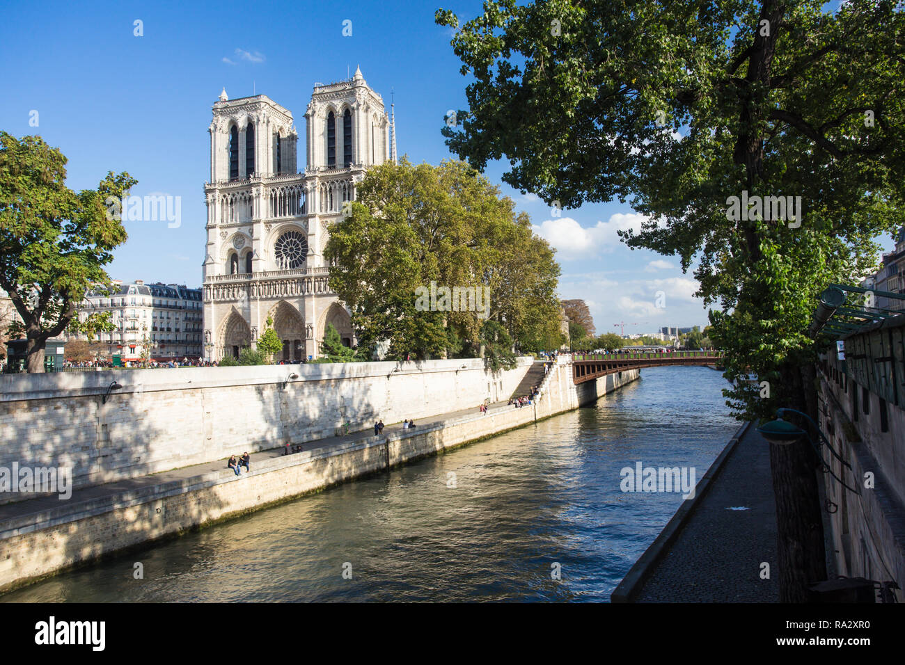 View of Notre Dame Cathedral in Paris France along Seine River Stock Photo
