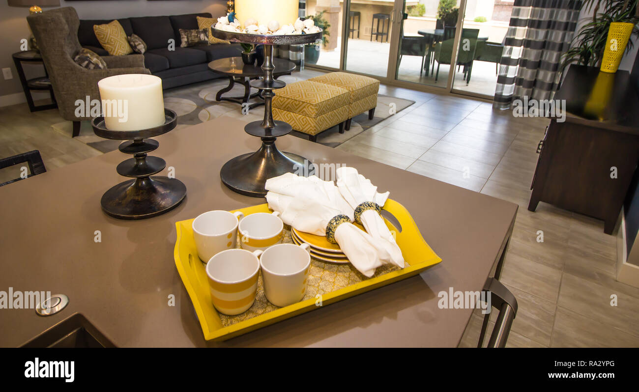 Tray Of Coffee Cups And Saucers On Kitchen Granite Counter Stock Photo