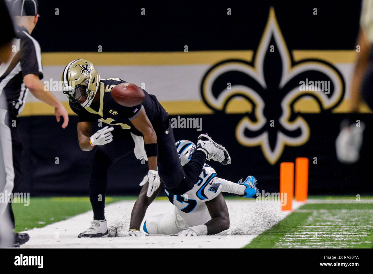 New Orleans, LA, USA. 30th Dec, 2018. Carolina Panthers defensive end Mario Addison (97) pushes New Orleans Saints quarterback Teddy Bridgewater (5) out of bounds at the Mercedes-Benz Superdome in New Orleans, LA. Stephen Lew/CSM/Alamy Live News Stock Photo