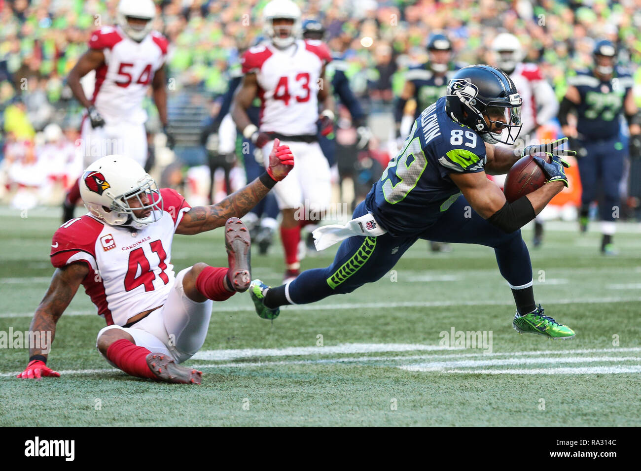 Seattle, WA, USA. 30th Dec, 2018. Arizona Cardinals safety Antoine Bethea (41) tackles Seattle Seahawks wide receiver Doug Baldwin (89) during a game between the Arizona Cardinals and the Seattle Seahawks at CenturyLink Field in Seattle, WA. The Seahawks defeated the Cardinals 27-24. Sean Brown/CSM/Alamy Live News Stock Photo