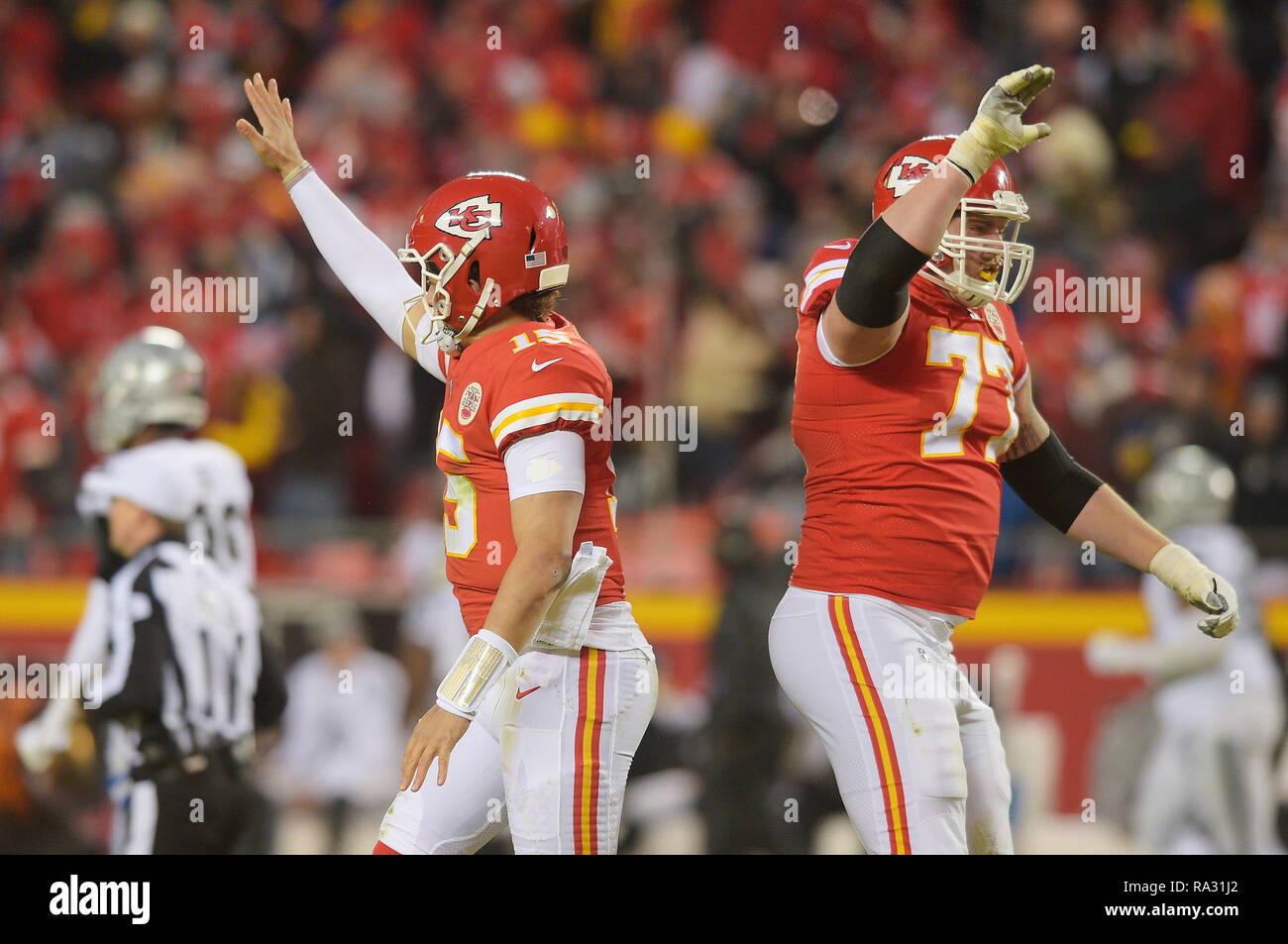 Kansas City, Missouri, USA. 30th Dec, 2018. Kansas City Chiefs quarterback Patrick Mahomes (15) and Kansas City Chiefs offensive guard Andrew Wylie (77) celebrate after a touchdown pass by Mahomes during the NFL Football Game between the Oakland Raiders and the Kansas City Chiefs at Arrowhead Stadium in Kansas City, Missouri. Kendall Shaw/CSM/Alamy Live News Stock Photo