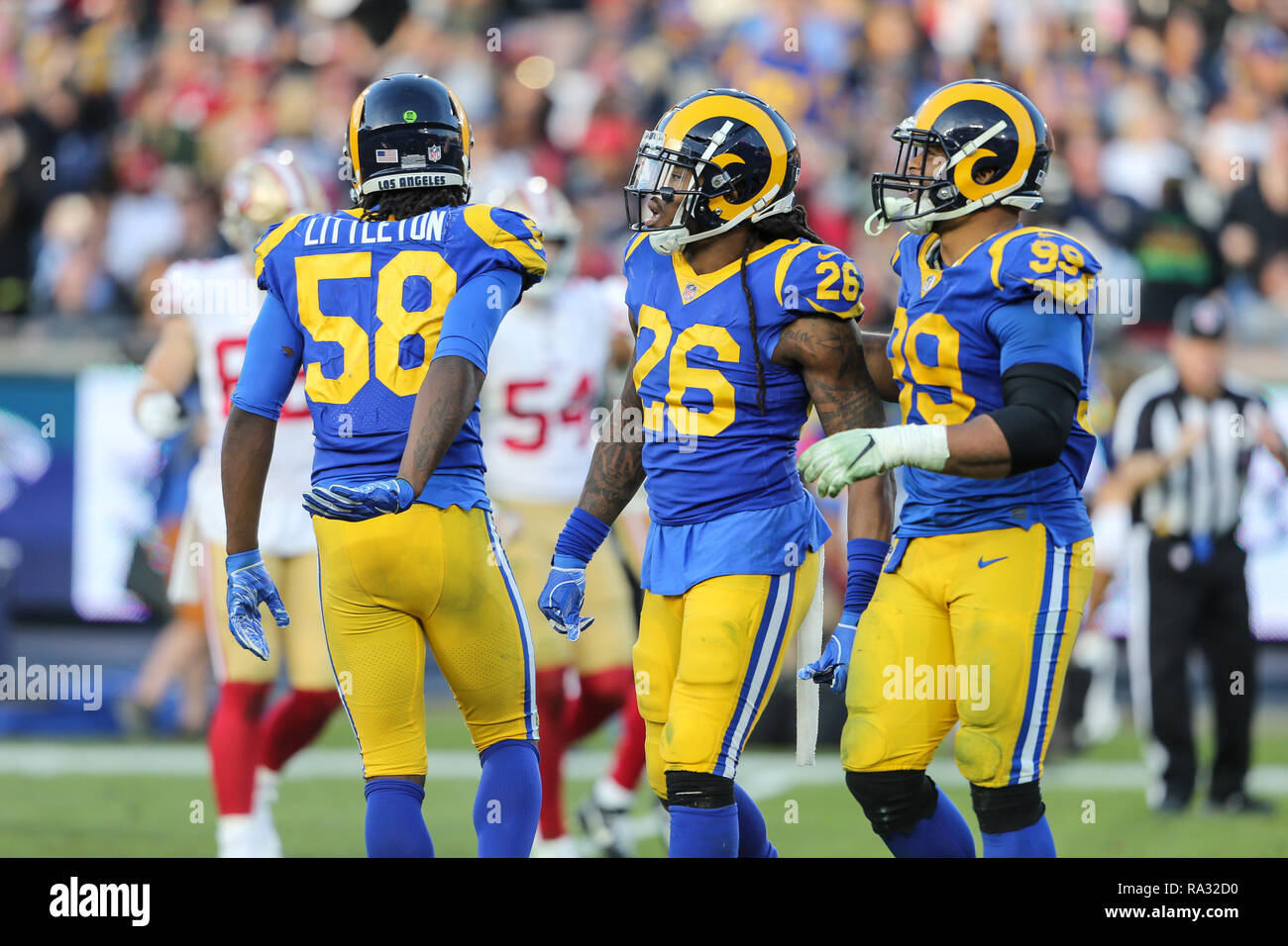 Los Angeles, CA, USA. 30th Dec, 2018. Los Angeles Rams inside linebacker  Mark Barron #26 watching his sack on the replay board with Los Angeles Rams  defensive end Aaron Donald #99 during