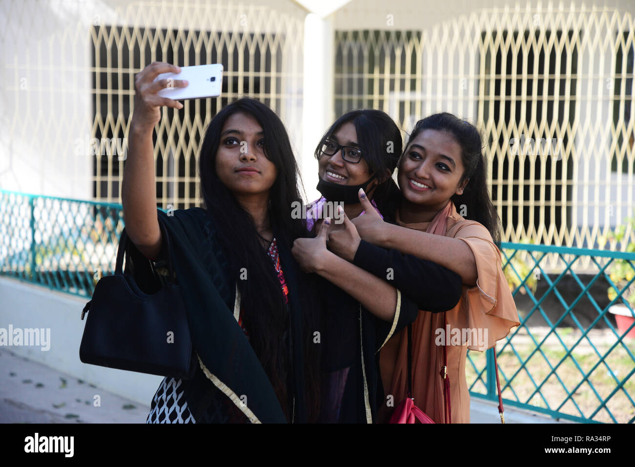 Dhaka, Bangladesh. 30th Dec, 2018. First time Bangladeshi women voters take a selfie after casting their vote at a polling station in Dhaka, Bangladesh, on December 30, 2018 Credit: Mamunur Rashid/Alamy Live News Stock Photo