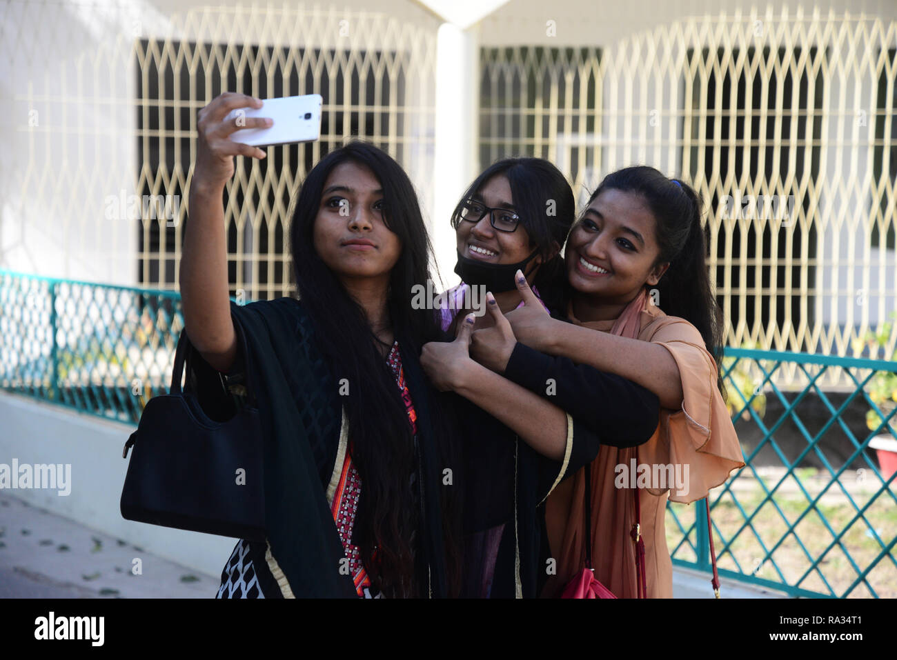 Dhaka, Bangladesh. 30th Dec, 2018. First time Bangladeshi women voters take a selfie after casting their vote at a polling station in Dhaka, Bangladesh, on December 30, 2018 Credit: Mamunur Rashid/Alamy Live News Stock Photo