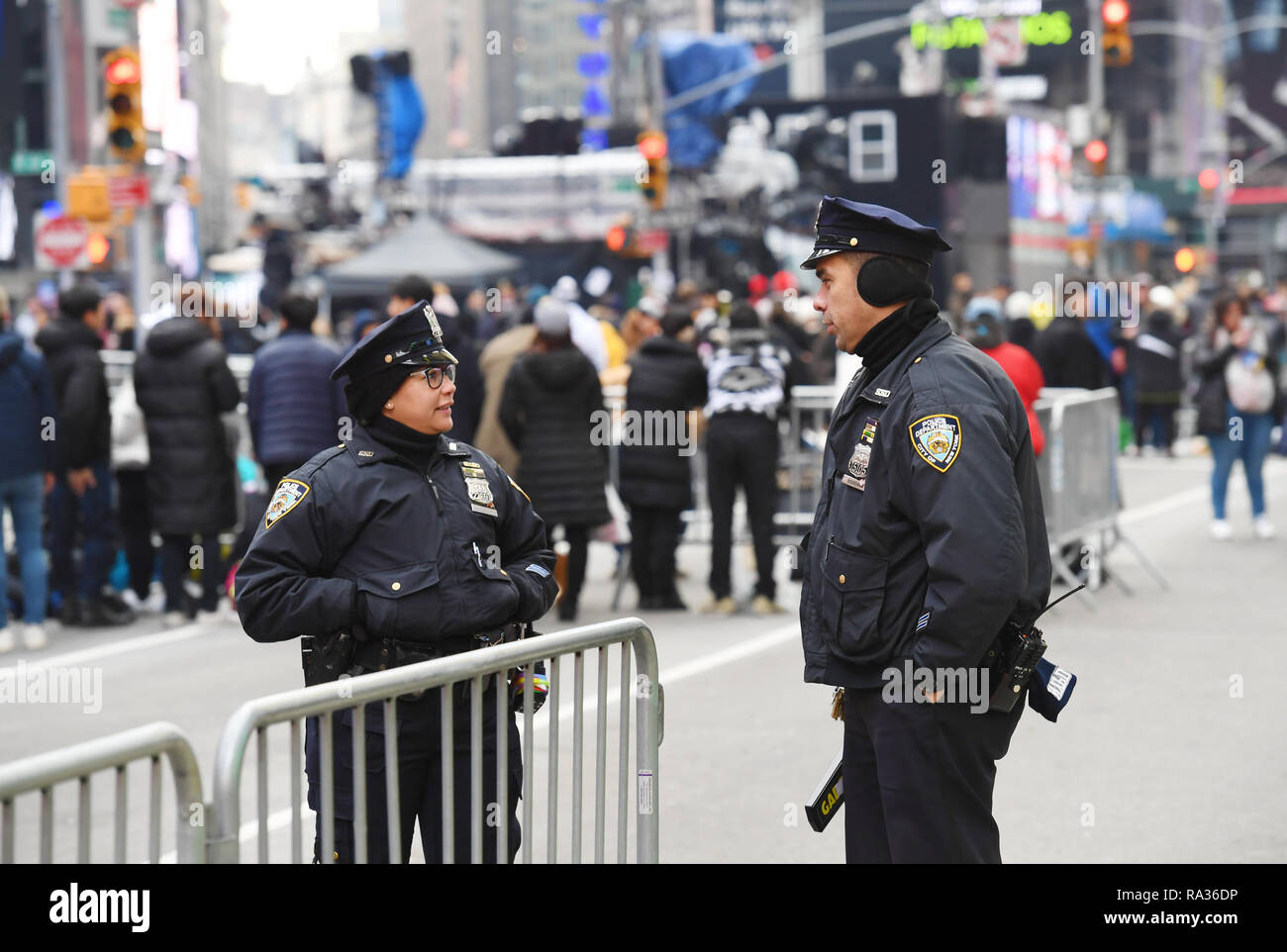 New York, USA. 31st Dec, 2018. Police officers stand guard on Times ...