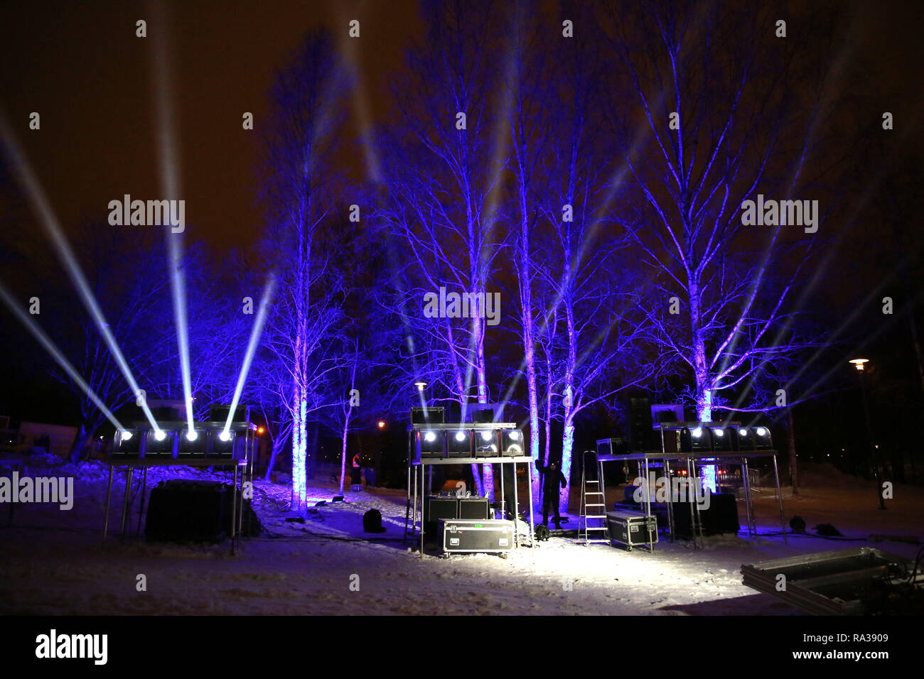 (190101) --ESPOO, Jan. 1, 2019 (Xinhua) -- A staff member packs up the equipment after a massive laser show held to celebrate the New Year in the city of Espoo, Finland, on Dec. 31, 2018. Espoo becomes the first city in Finland to replace fireworks with laser show when celebrating the New Year. The public demand for banning the use of fireworks is constantly rising in recent years in Finland, aiming to reduce the cases of injuries, air pollution and stress and anxiety in animals caused by fireworks. (Xinhua/Li Jizhi) Stock Photo