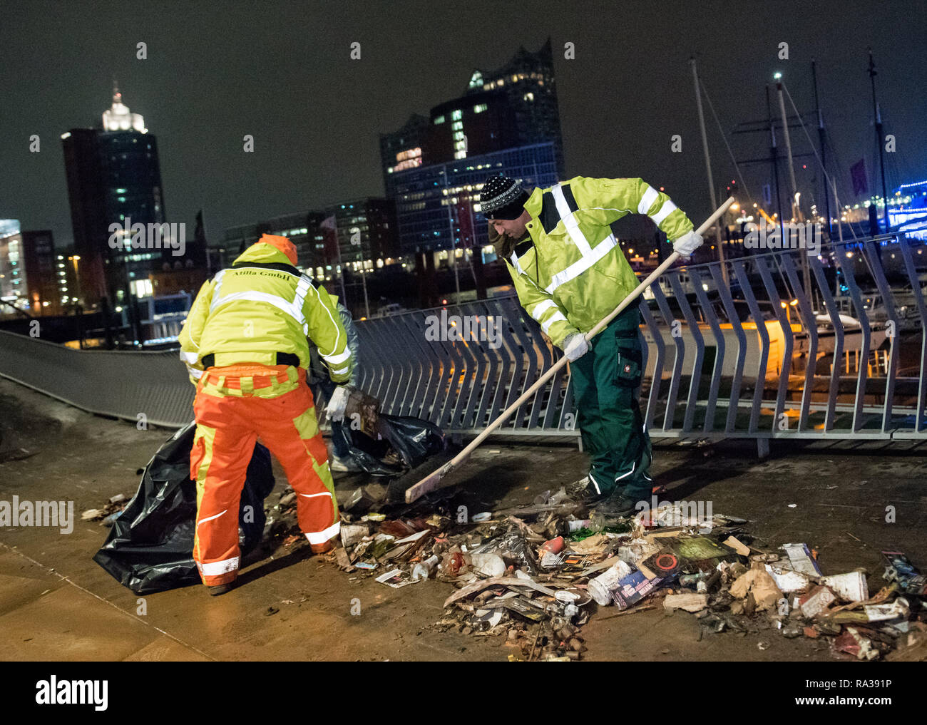 Hamburg, Germany. 01st Jan, 2019. Employees of a cleaning company clean
