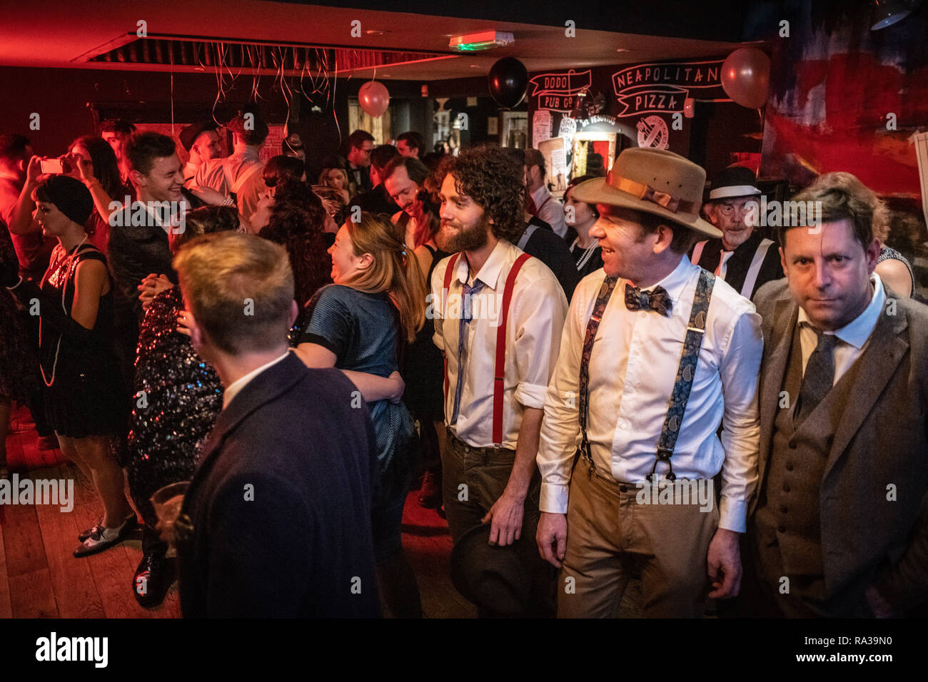 Oxford, UK. 31st Dec, 2018. New Year's Eve party in Oxford. The Rickety  Press through a celebration of the 1920s, complete with blacked out windows  and a performance by the Rabbit Foot