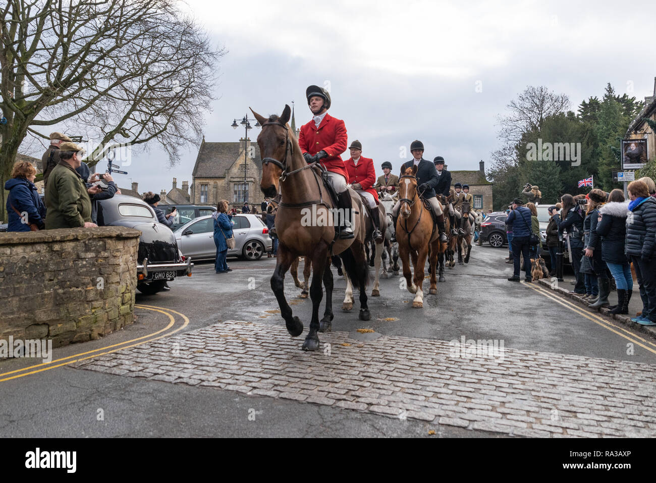 Stow On The Wold, UK. 01st Jan, 2019. Stow-on-the-wold, Gloucestershire. UK. 01/01/19 The annual New Years Day Hunt meet in Stow-On-The-Wold. The Hunt Masters in Hunting Pink leading the horses away from the square A marked increase in spectators and followers this year. Credit: Desmond J Brambley Credit: Desmond Brambley/Alamy Live News Stock Photo