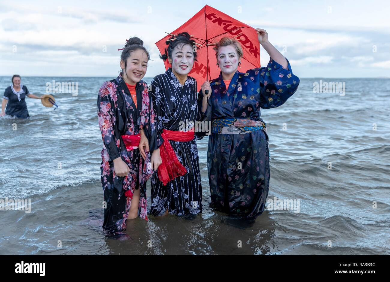 Portobello, Edinburgh, Scotland, UK. 01st Jan, 2019. The traditional Loony  Dook took place at Portobello just outside Edinburgh. Revellers dressed in  costumes take a dip into the Firth of Forth to welcome