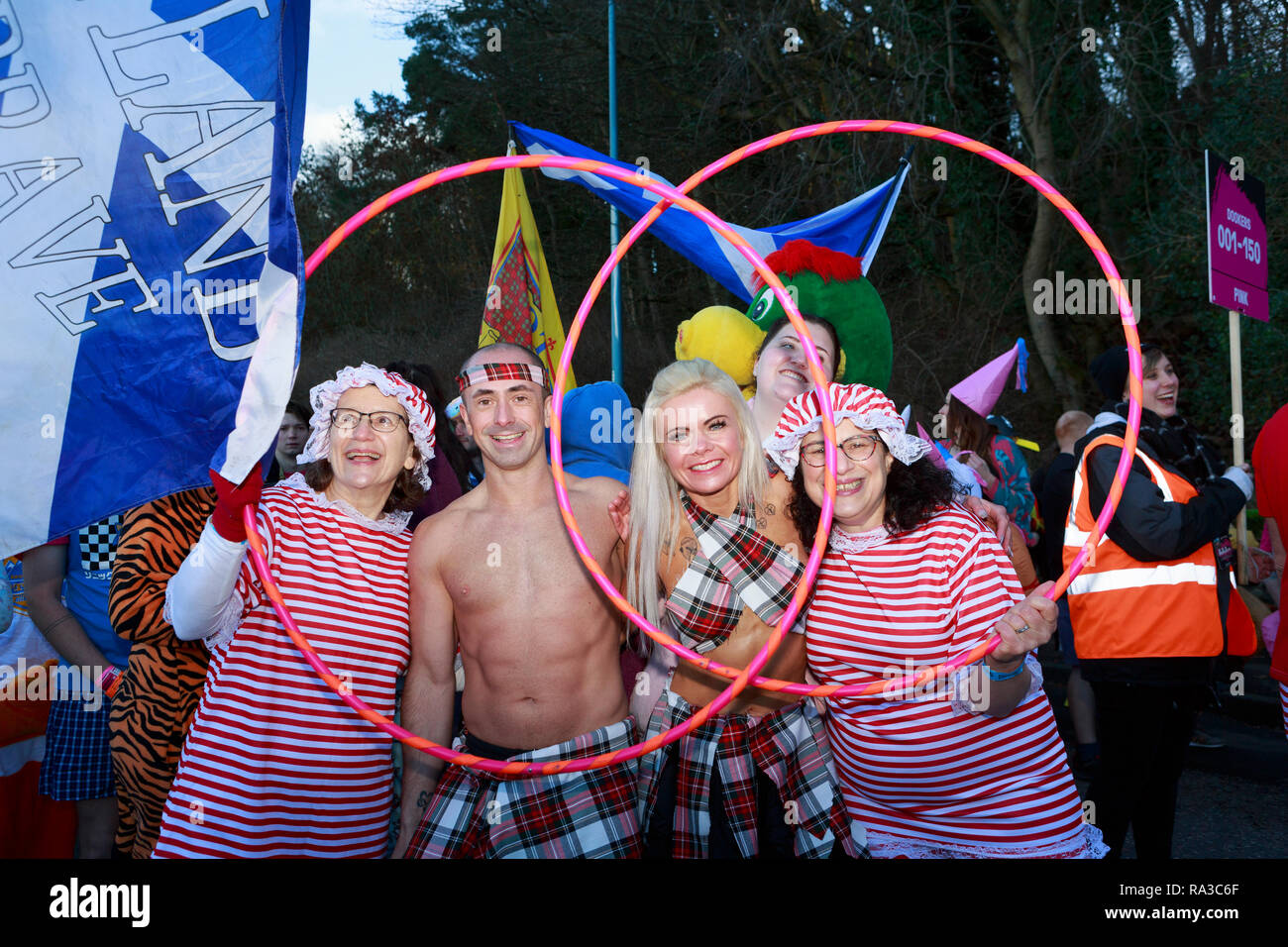 South Queensferry. Edinburgh. Scotland. 1st January 2019. UK.The Loony Dook continues its New Year’s Day tradition at Edinburgh’s Hogmanay. In the shadow of the Forth Bridges, the dippers in fancy dress raise money for charities. Dookers march the length of South Queensferry High Street led by The Noise Committee drummers as part of the Dookers' Parade. Edinburgh. Credit: Pako Mera/Alamy Live News Stock Photo