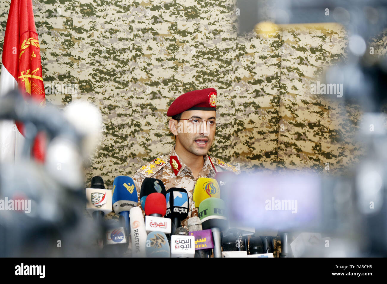 Beijing, Yemen. 31st Dec, 2018. Spokesperson of the Houthi rebels Yahya Sarie speaks during a press conference in Sanaa, Yemen, Dec. 31, 2018. Yemen's rival forces on Monday traded accusations of breaching a UN-brokered ceasefire in flashpoint Red Sea port city of Hodeidah. Credit: Mohammed Mohammed/Xinhua/Alamy Live News Stock Photo