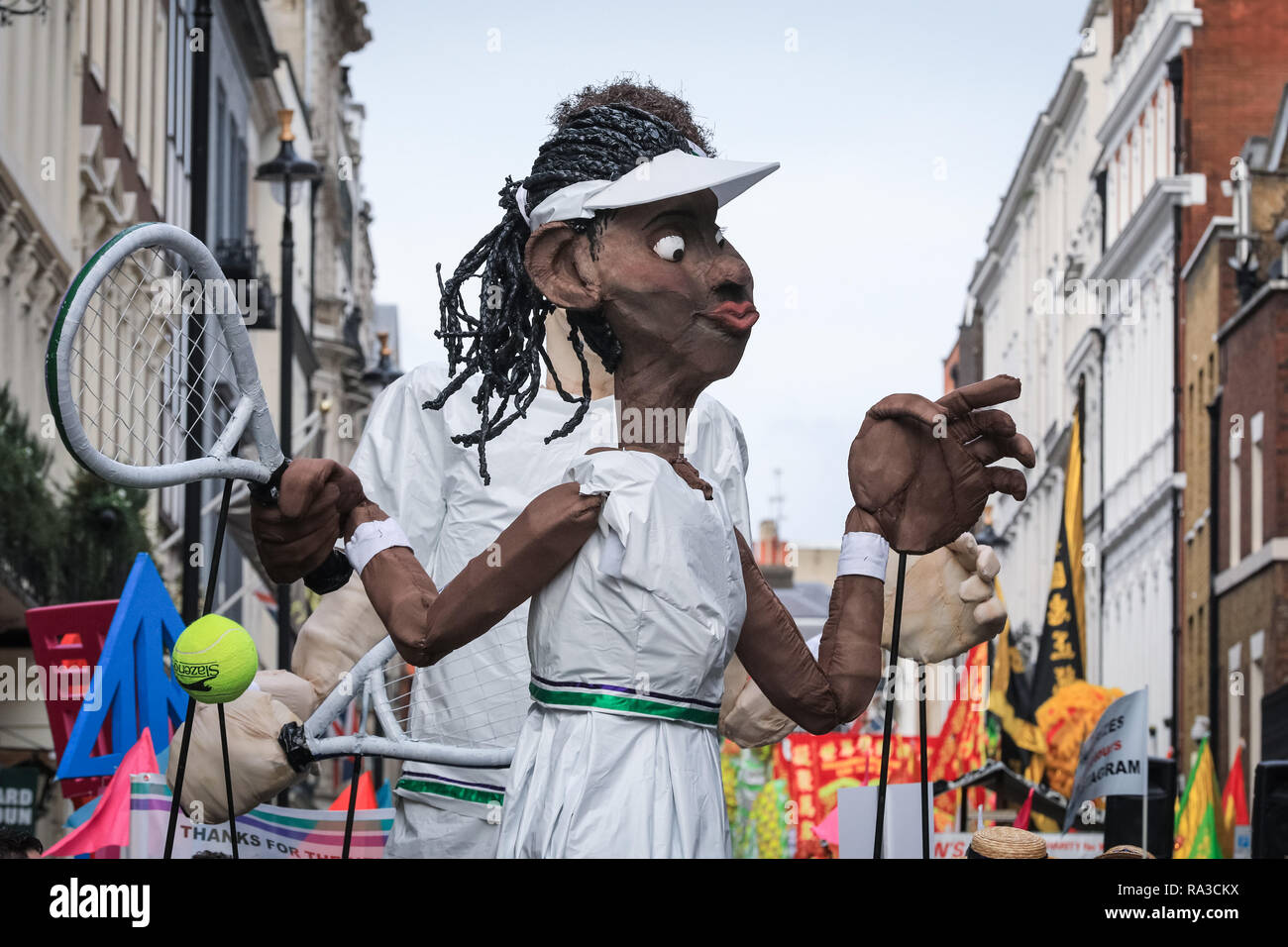 London, UK. 1st Jan 2019. The Borough of Merton's float features giant Wimbledon Tennis players. London's New Year's Day Parade 2019, or LNYDP, features just over 10,000 participants from the USA, UJ and Europe perform in marching bands, cheer leading squads, themed floats from London's Boroughs, and many other groups. The route progresses from Piccadilly via popular landmarks such as Trafalgar Square towards Whitehall in central London every year. Credit: Imageplotter News and Sports/Alamy Live News Stock Photo