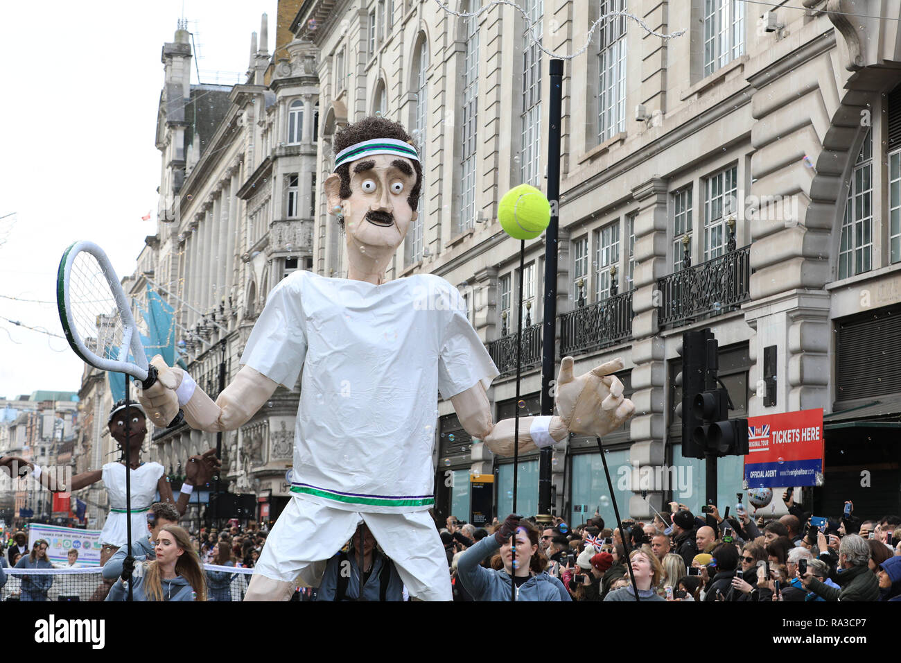London, UK. UK. 01st Jan, 2019. London, UK. 1st Jan 2019. The Borough of  Merton's float features giant Wimbledon tennis players in action. London's  New Year's Day Parade 2019, or LNYDP, features