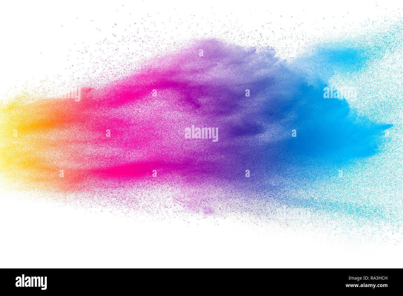 Multi color powder explosion on white background. Launched colorful dust particles splashing. Stock Photo