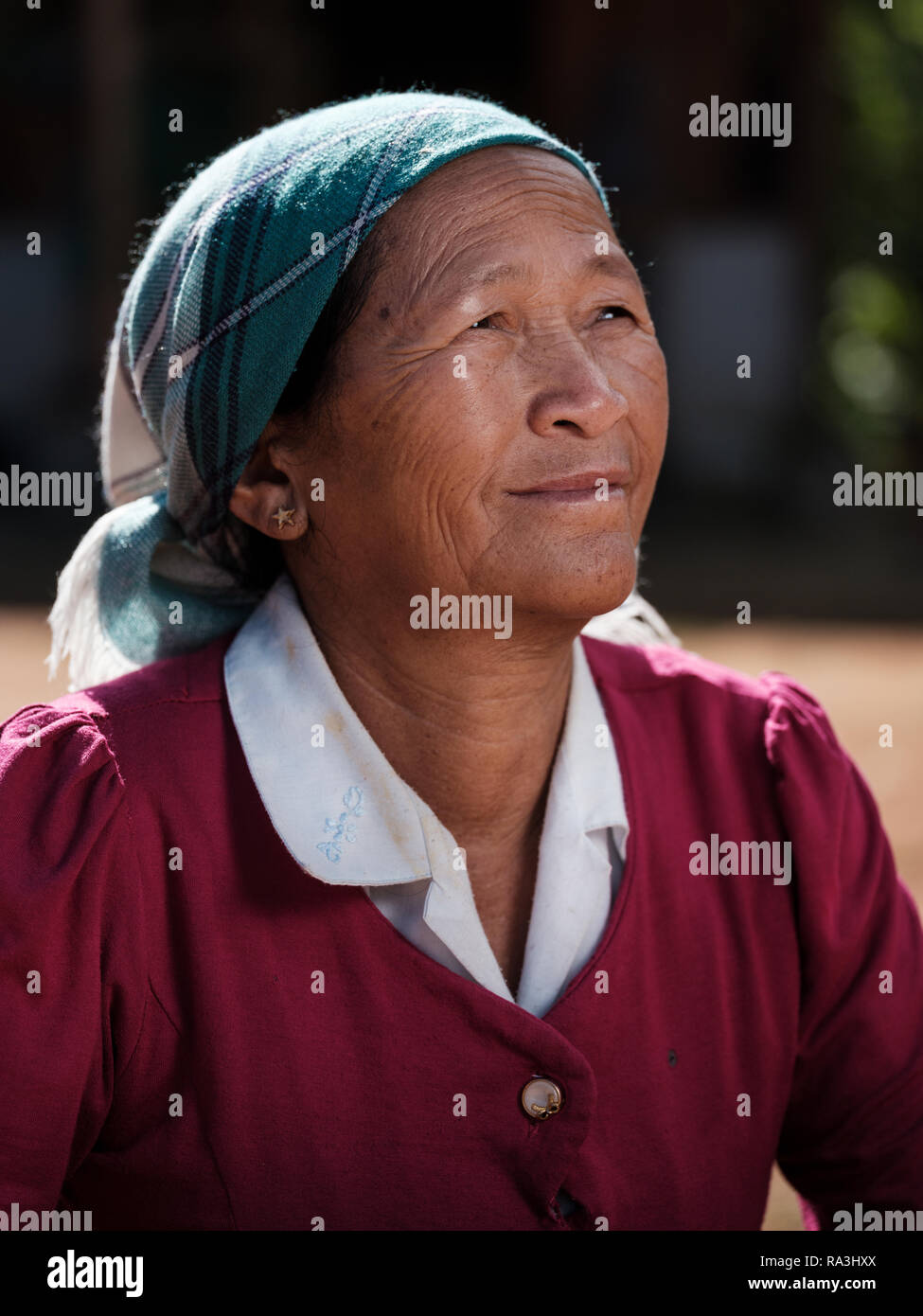 KYAING TONG, MYANMAR - CIRCA DECEMBER 2017:  Portrait of Wa woman working at the Naung Cho Wa Village of  near Kyaing Tong in Myanmar Stock Photo