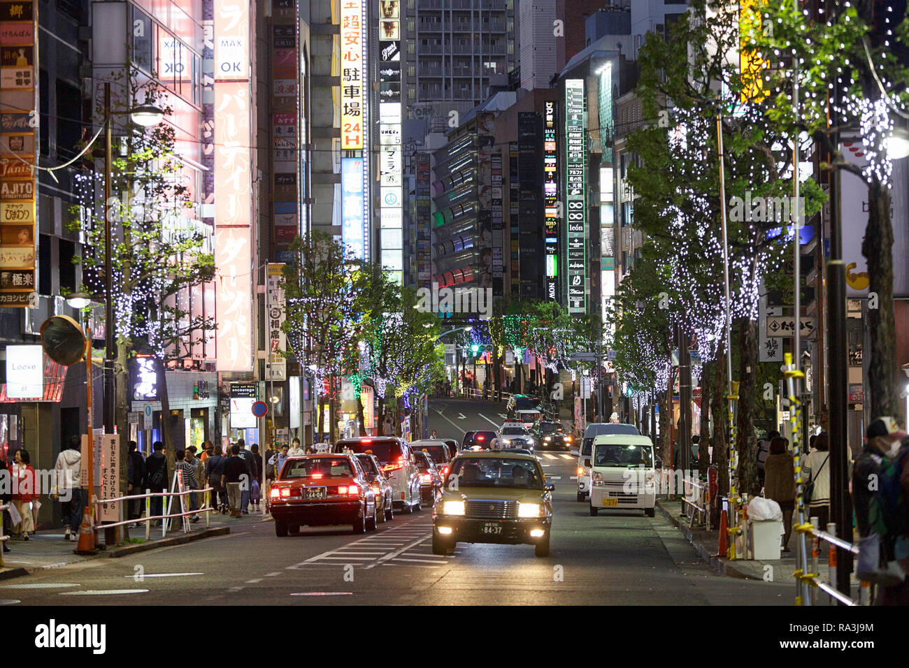 Tokyo's busy street at dusk, Tokyo, Japan. Stock Photo
