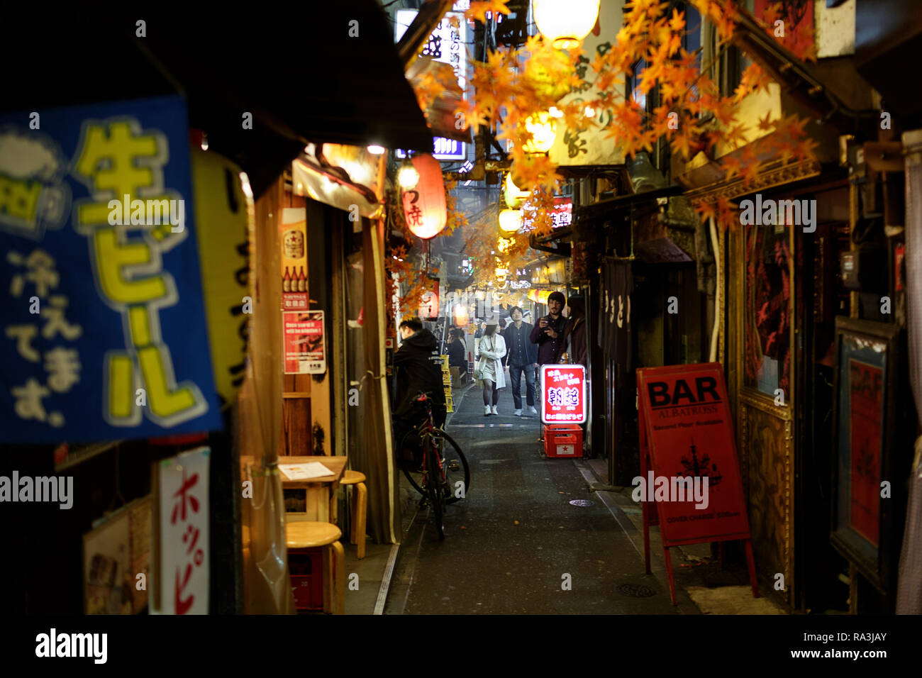 Hot and smoky Tokyo street restaurants, as locals eat and drink into the night. Japan Stock Photo