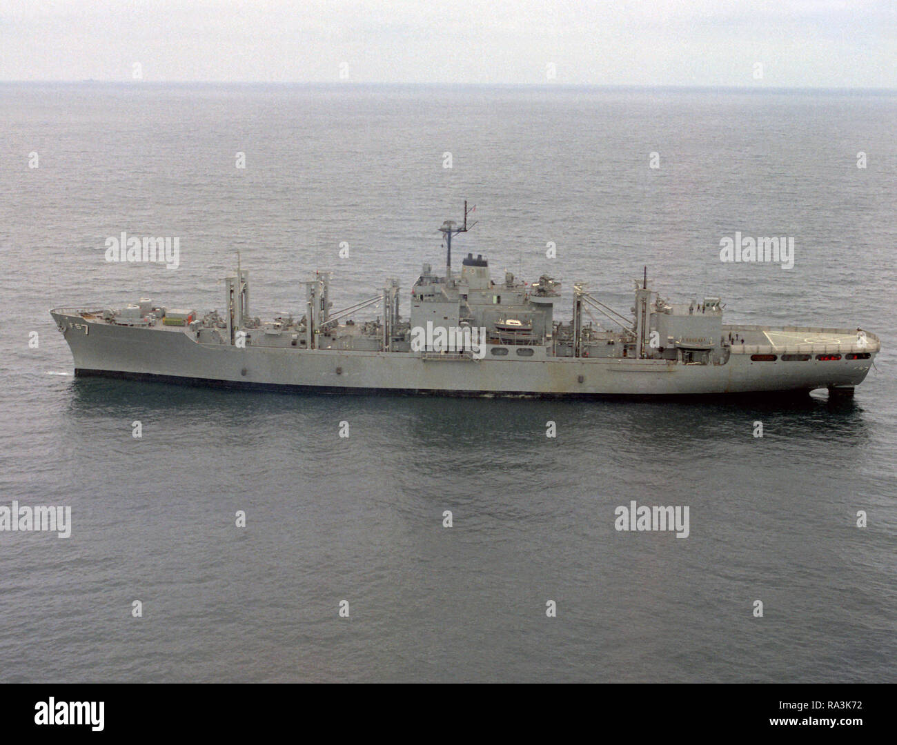 1971  - an aerial port beam view of the combat stores ship USS SAN JOSE (AFS-7) off the coast of San Diego. Stock Photo