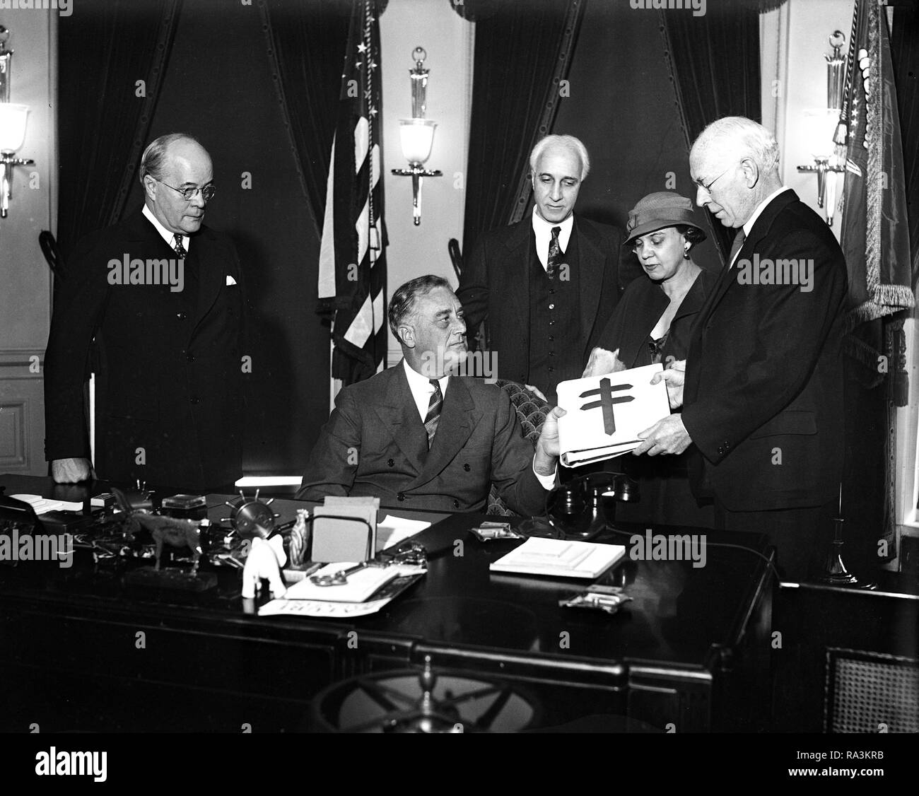 President Franklin Roosevelt is given a rare collection of Christmas Seals ca. 1933 Stock Photo