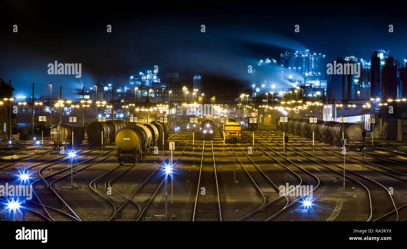 Railway tracks with freight trains, freight station at night, Godorf, Cologne, North Rhine-Westphalia, Germany Stock Photo
