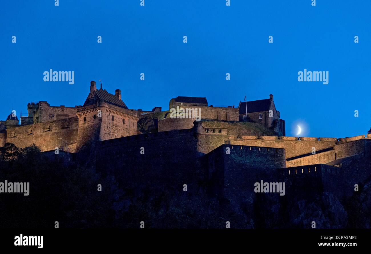 Castle by night with crescent moon, Edinburgh, Scotland, Great Britain Stock Photo