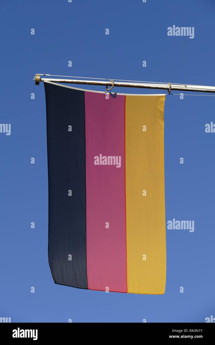 German flag in front of blue sky, Bremen, Germany Stock Photo
