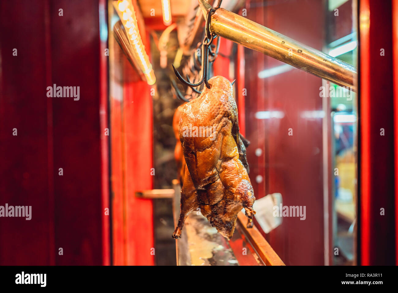Peking duck is roasting in the oven, preparing to serve on the cost