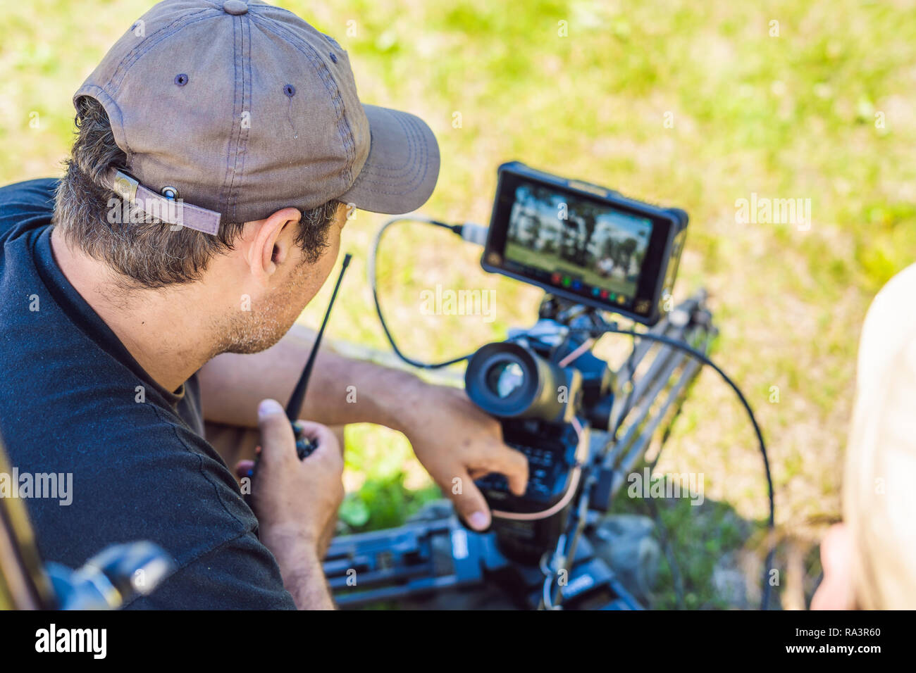 Shooting process on cinema stage - commercial production set, exterior  location.Profeccional cameraman operates the camera Stock Photo - Alamy