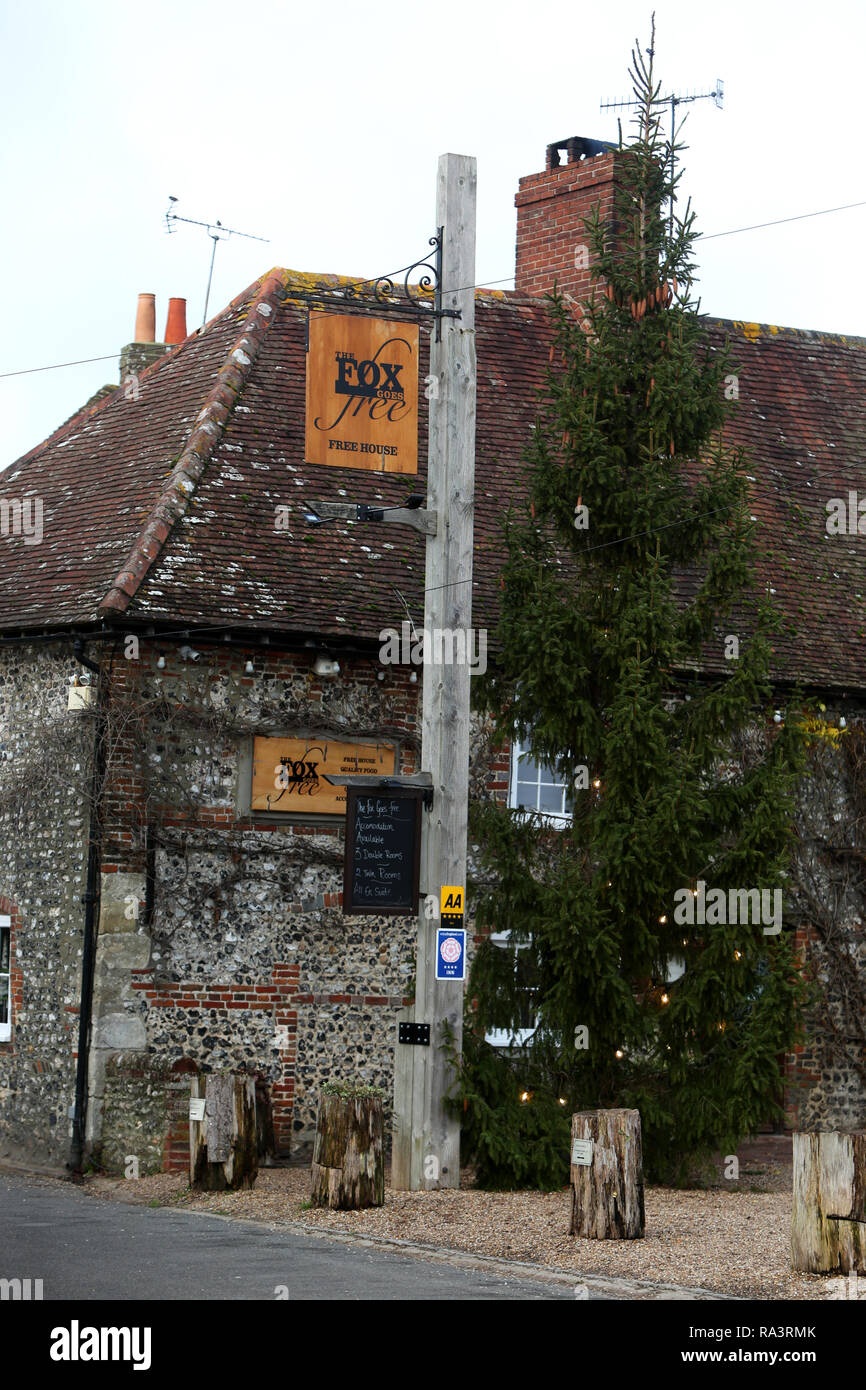 General view of the Fox Goes Free Pub in Charlton, West Sussex, UK