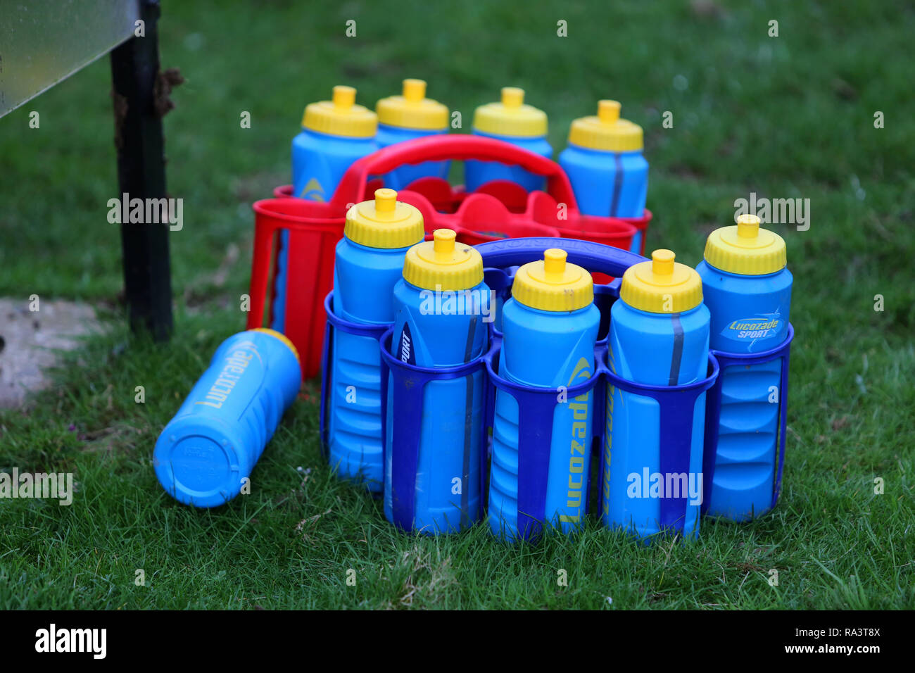 Bottles of Lucozade ready for a half time break during a match, Chichester, West Sussex, UK. Stock Photo