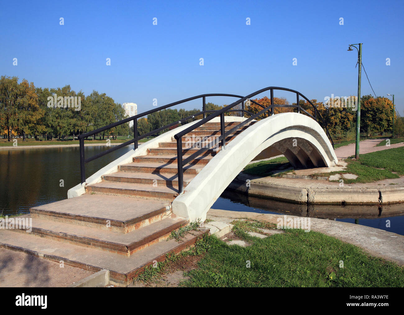 bridge over pond with handhold Stock Photo