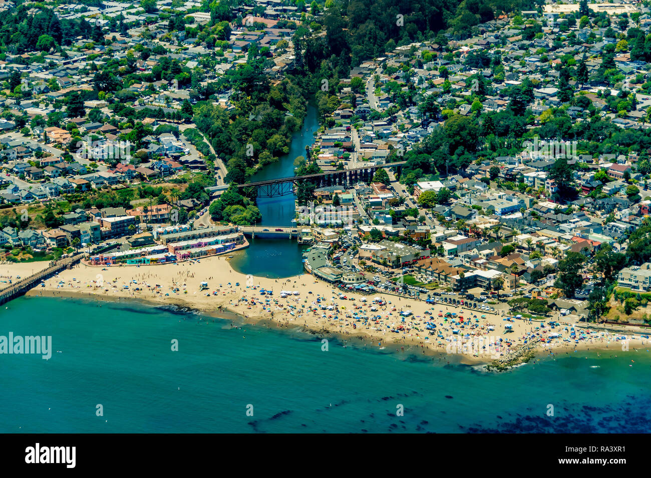 The aerial view of the beach with tourists in the city of Capitola in Northern California, close to the city of Santa Cruz. Stock Photo