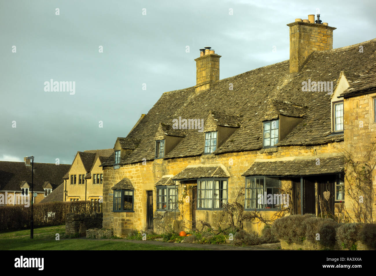 The picturesque quintessential Cotswold village of Broadway with its Cotswold stone buildings and houses and cottages Stock Photo