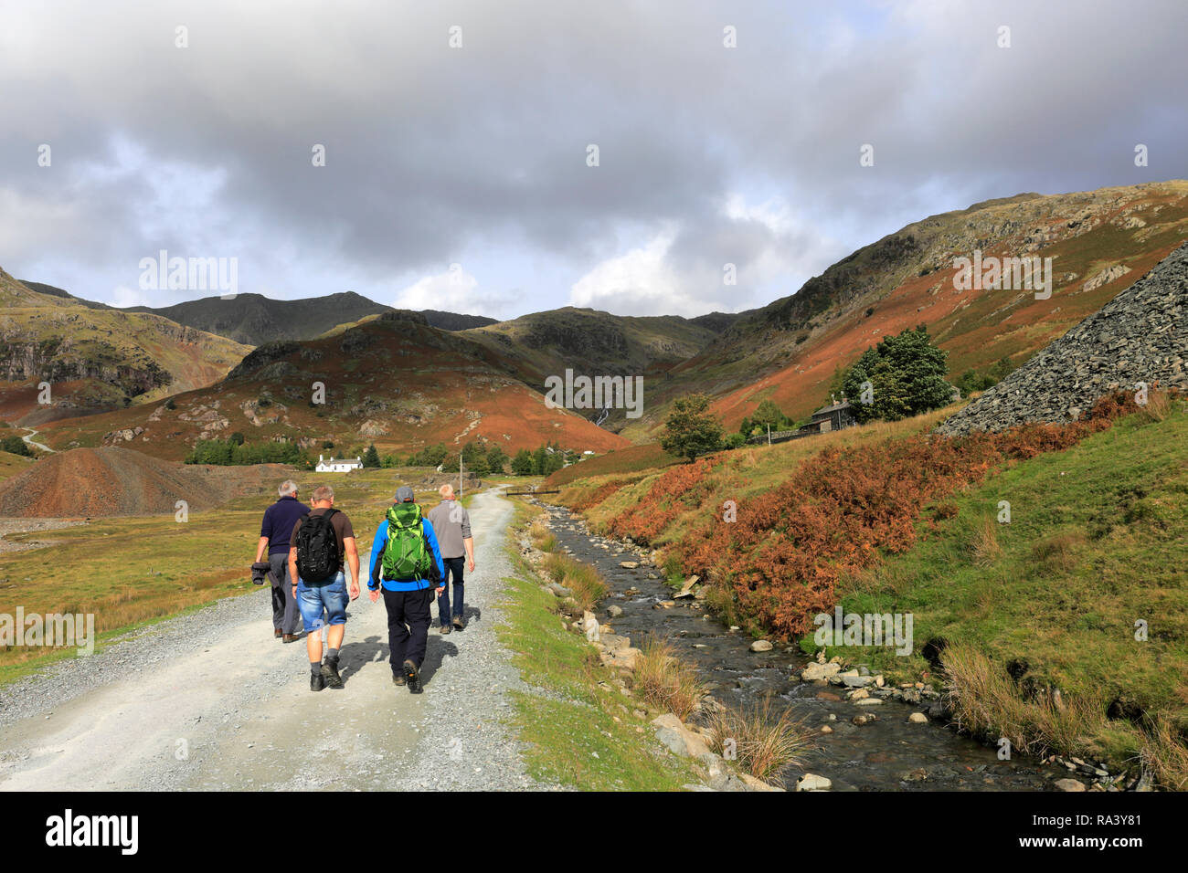 Walkers in the Copper Mines Valley above Coniston town, Lake District National Park, Cumbria, England, UK Stock Photo