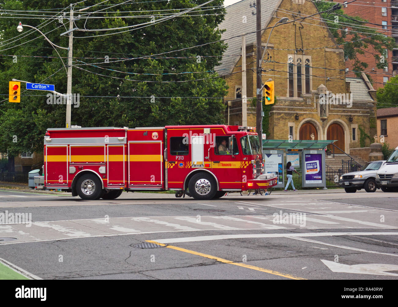 Fire truck racing along street, responding to emergency, Toronto, Ontario, Canada Stock Photo