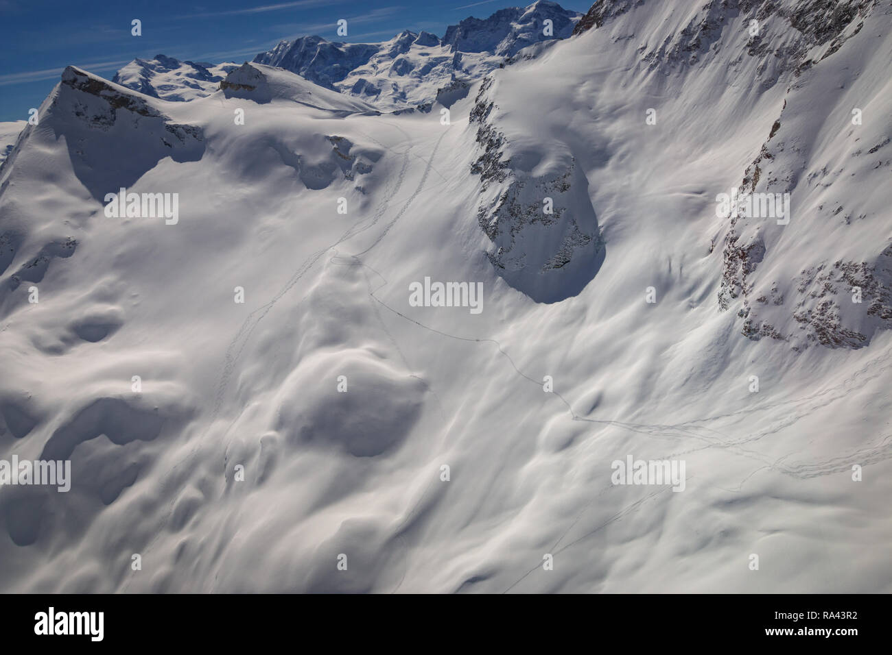 Aerial view of landscape in the Swiss alps near Zermatt with tourers ...