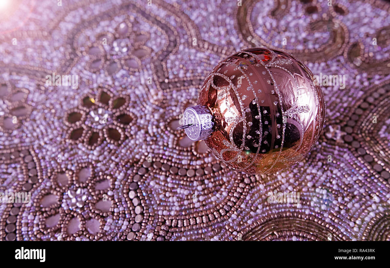 A richly decorated Christmas ball and table decoration, all copper colour. Stock Photo