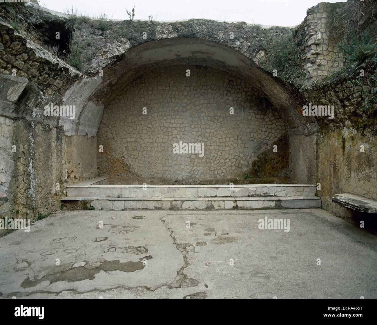 Italy. Herculaneum. Urban baths. The Central Termae. They were built around the beginning of the 1st century AD. They are subdivided into sections for men and women. Male 'calidarium', the hot water bath. Marble pool. Campania. Stock Photo