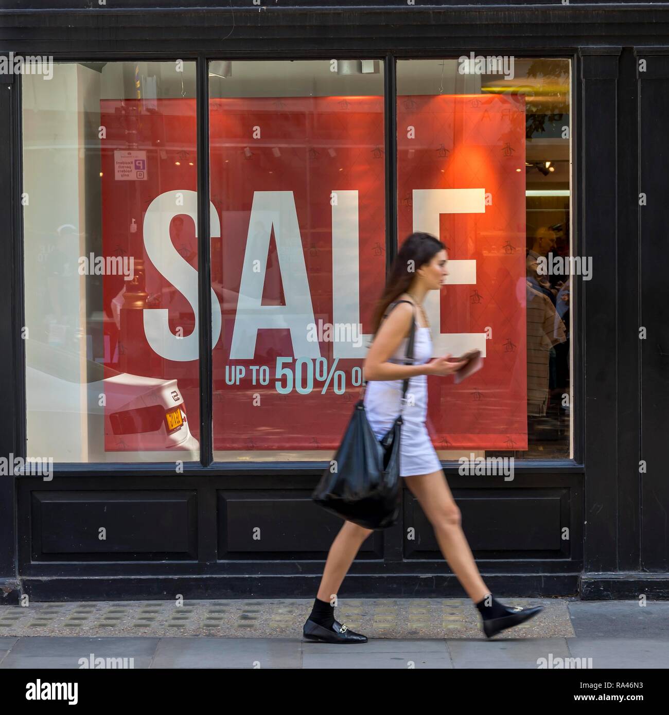 Passer-by in front of sale, Sale, Oxford Street, London, United Kingdom Stock Photo