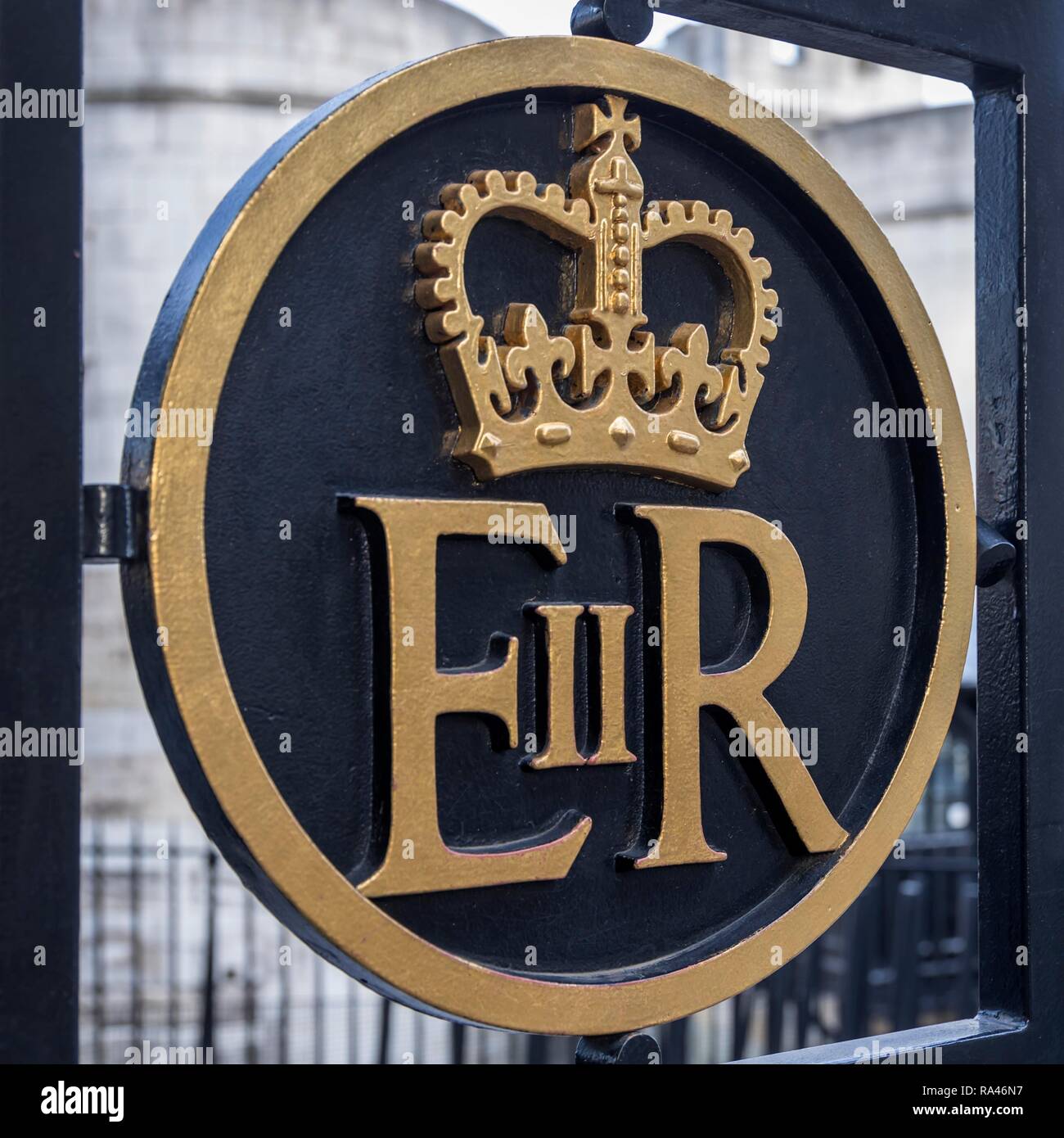 Sign of Queen Elizabeth II at a gate at the Tower of London, London, Great Britain Stock Photo