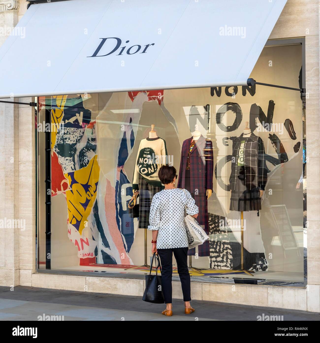 Passer-by in front of shop window, fashion shop Dior, London, United Kingdom Stock Photo