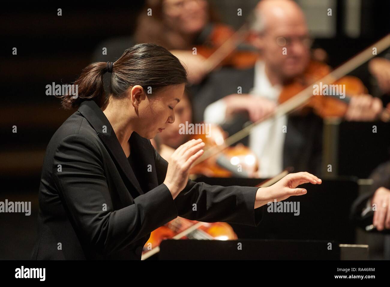 South Korean conductor Shiyeon Sung conducts the Staatsorchester Rheinische Philharmonie, concert of the Musik-Institut-Koblenz Stock Photo