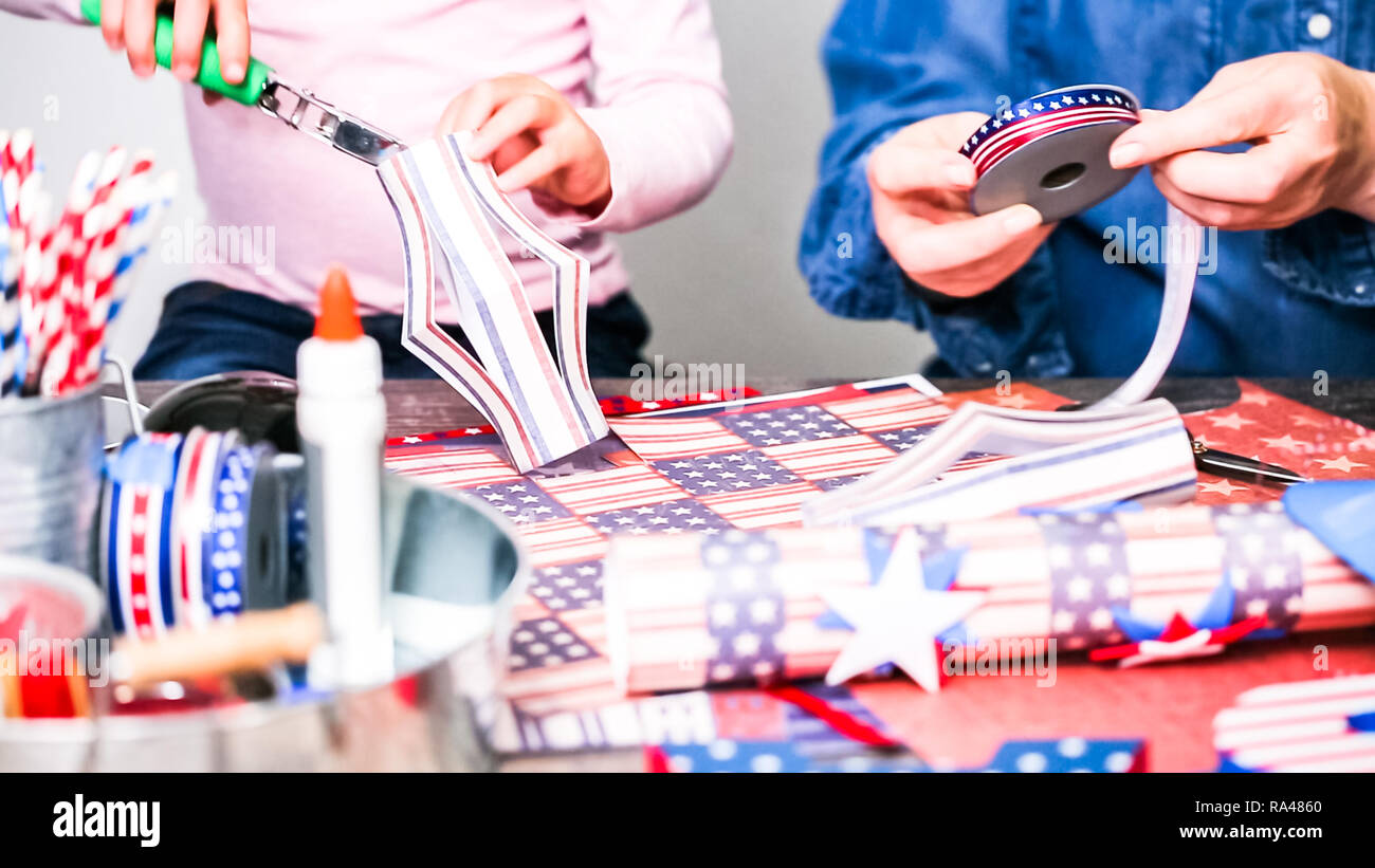 Step by step. Mother and daughter making paper firecrackers for July ...