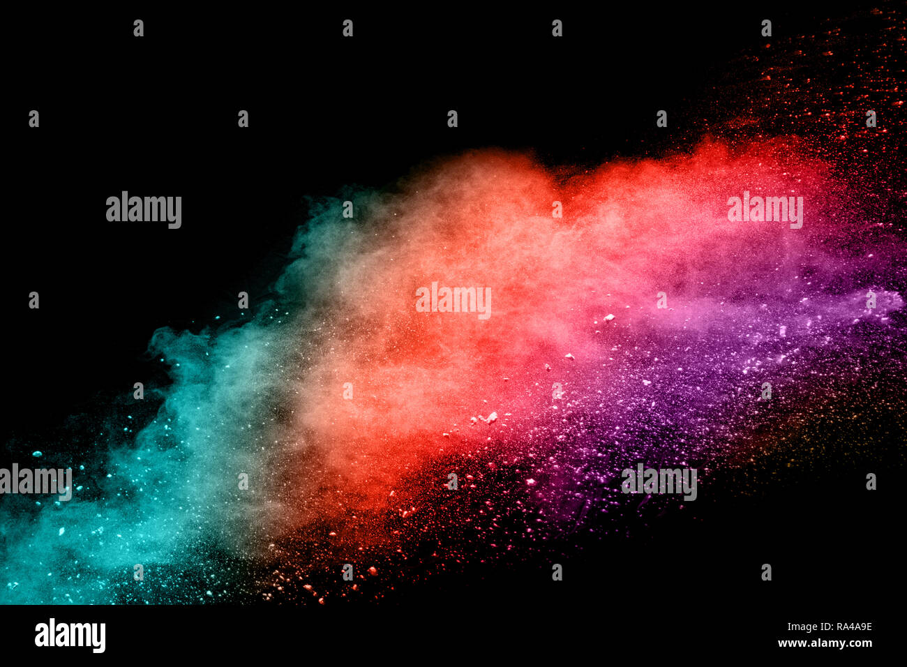 Abstract multicolored dust explosion on black background. Abstract color powder splattered  on dark background. Stock Photo